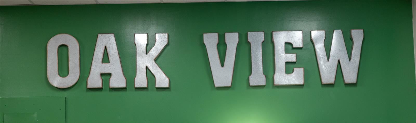 big letters that say oak view on a green background